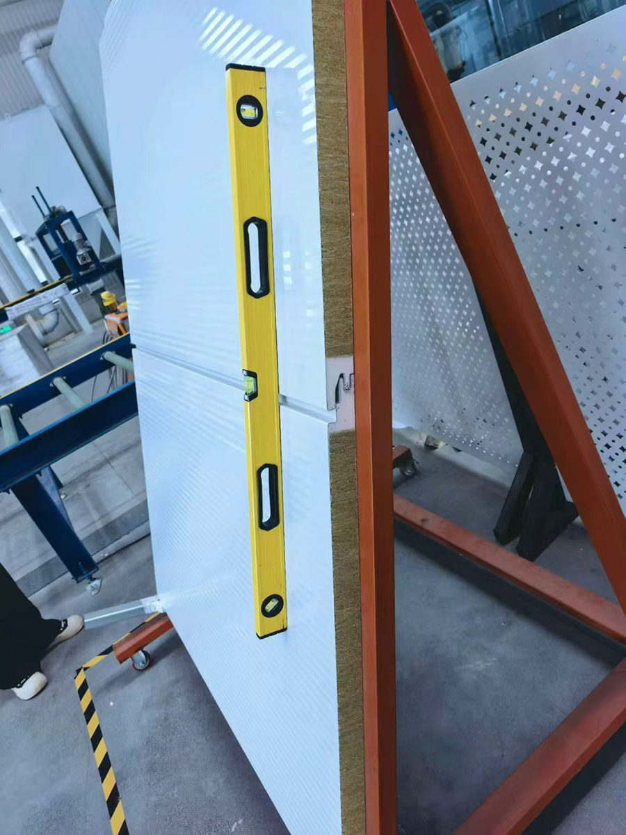 This image shows checking the overall flatness of the sandwich panel.